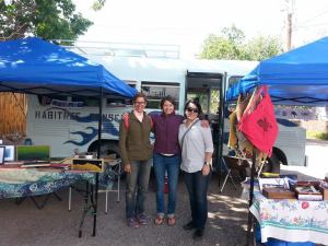 Hilary, Laura and Jessica with our two tents and blue bus