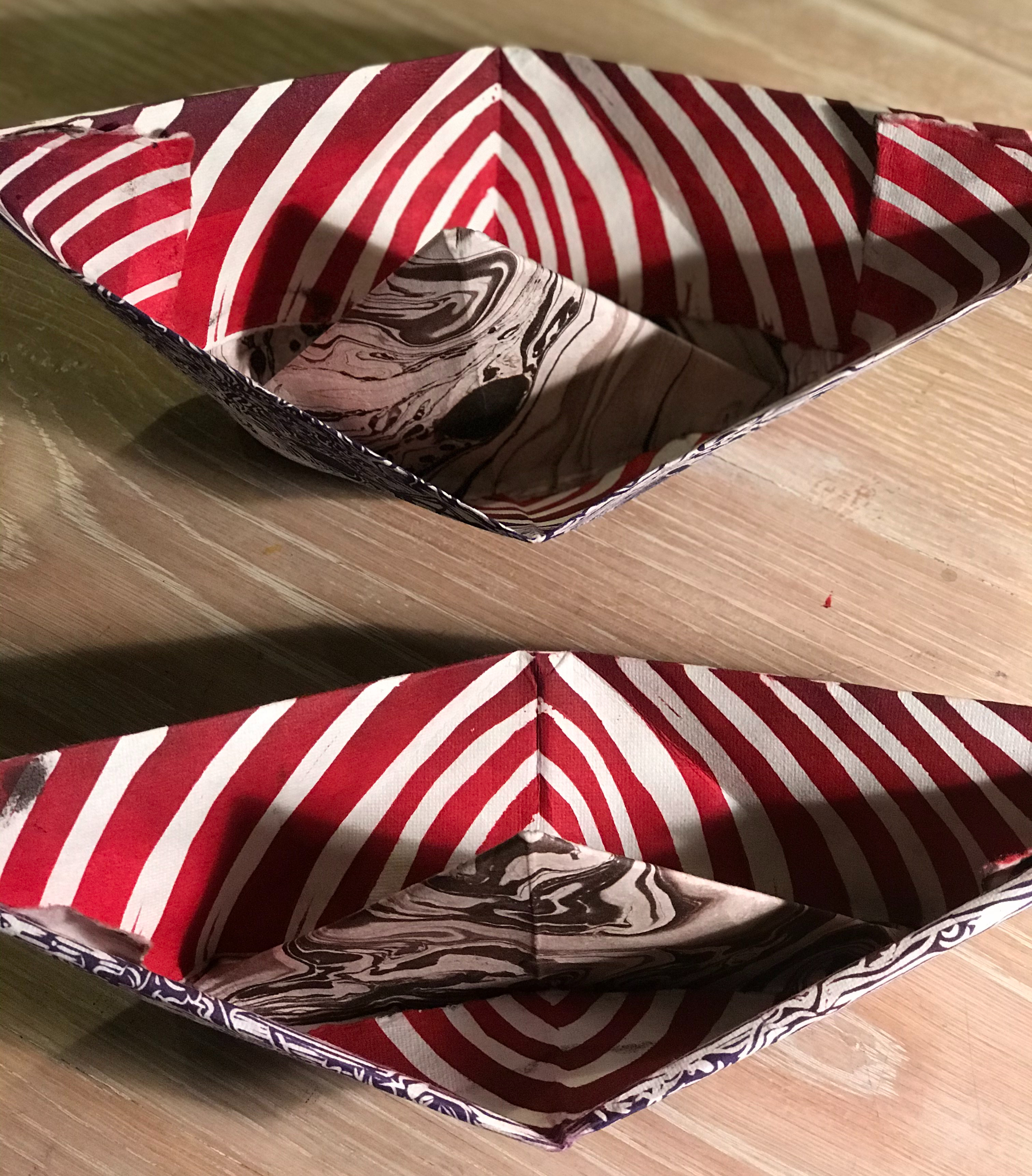 Top view of paper boats by Hilary Lorenz