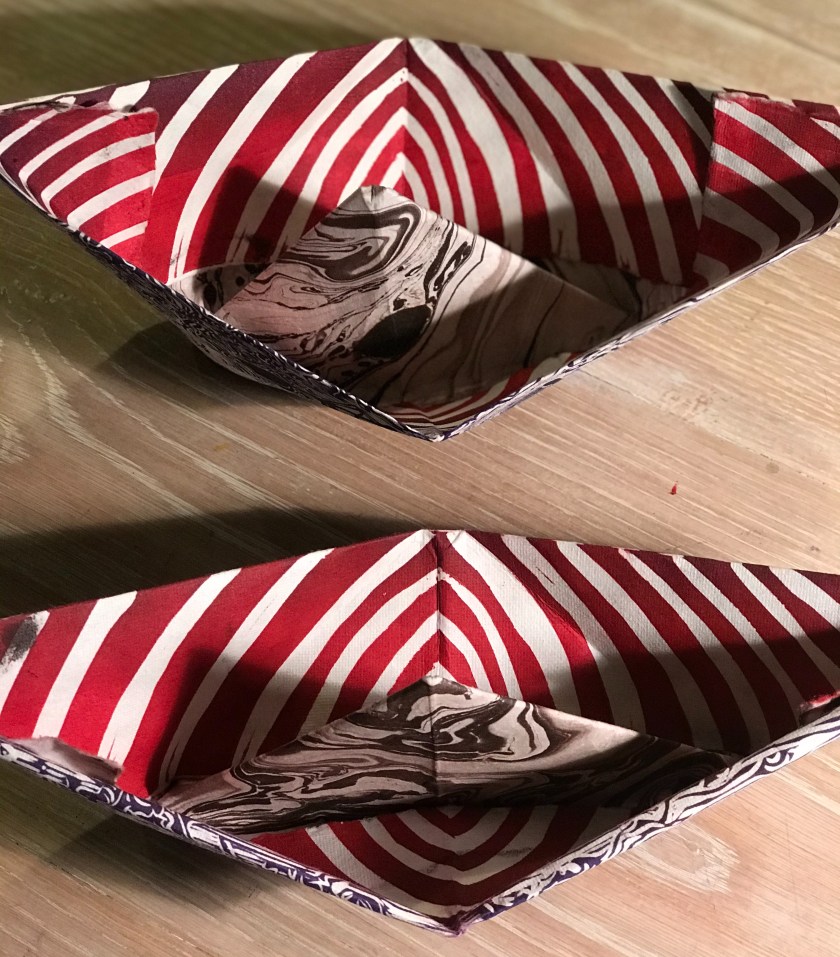 Top view of paper boats by Hilary Lorenz