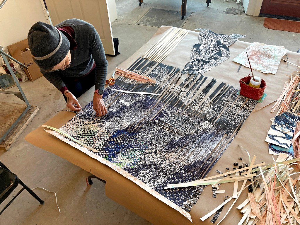 Hilary Lorenz weaving paper.